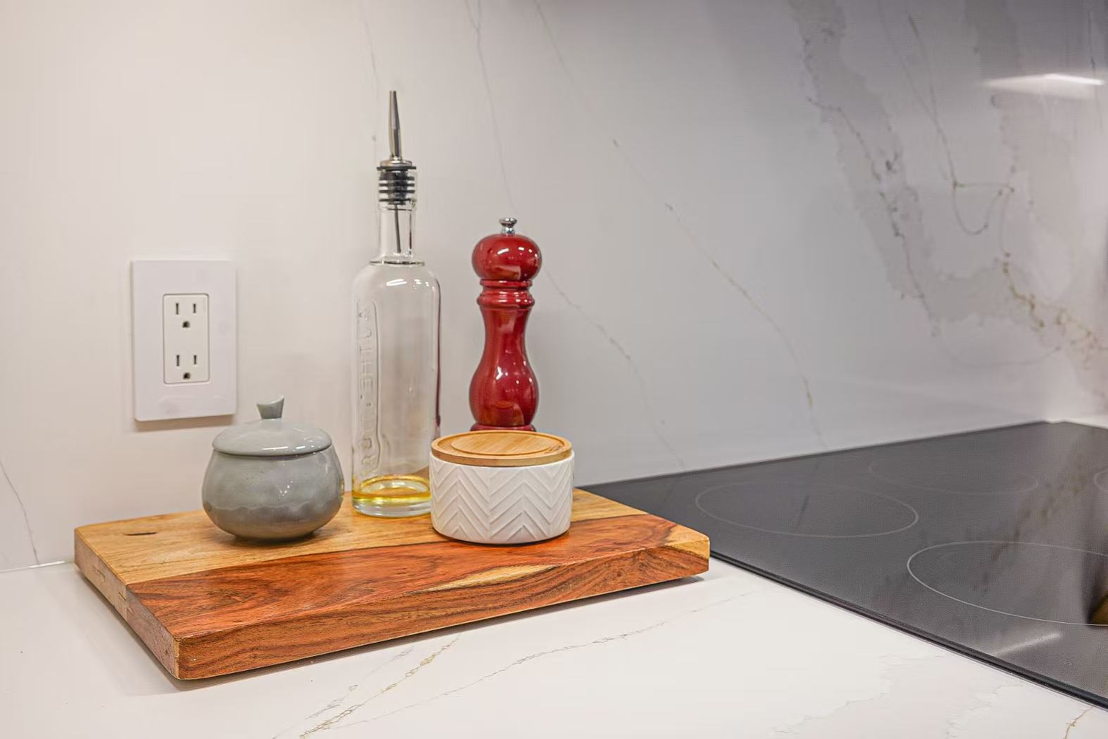 Detailed view of a quartz countertop and backsplash